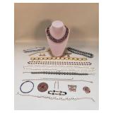 Group of costume jewelry, violet collar, brooch