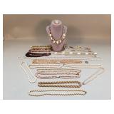 Group of costume jewelry, faux pearls, faux amber