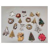 Group of vintage holiday themed brooches, pendants