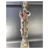 Vintage African sculpture with adorned beads,
