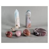 Group of pink jasper egg form figures  ocean