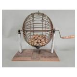 Vintage tabletop bingo cage spinner filled with