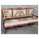 French Louis XV-style carved walnut sofa with