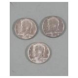 Three United States Kennedy half dollar coins