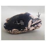 Half cut geode with pewter figurines