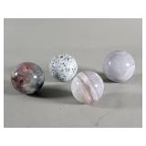 Four polished agate and jasper spheres