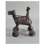 Vintage bronze camel and rider toy on wheels