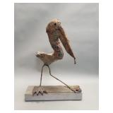 Brutalist iron crane sculpture on wood base