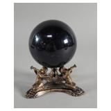 Onyx sphere on a brass  cherub stand