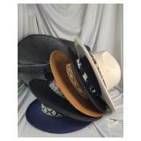 5 western style cowboy hats in carrying case