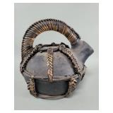 Primitive style black earthenware water