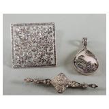 Three sterling silver, marcasite and rhinestone