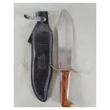 Stainless steel, brass and wood hunting knife