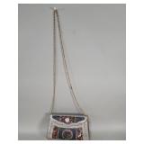 Handcrafted silver-tone metal sling clutch