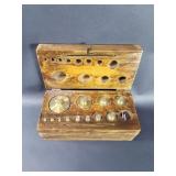 Set of vintage brass scale weights in a hinged