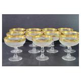 Eleven crystal Champagne coupes with gold rims