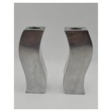 Pair of modernist curved metal candleholders