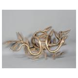 Brass serpentine wall mount