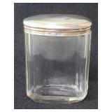 Vintage glass jar with silver hallmarked lid.