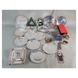 Twelve silver plate saucers, tin and plastic
