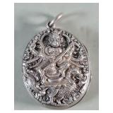 Antique Indian repousse silver locket depicting