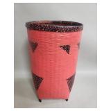 Vintage woven bamboo basket painted in coral red