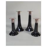 Four ceramic and silver candlesticks