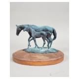 Signed vintage bronze horse figurine on a wood