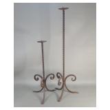 A pair of vintage wrought iron candle pickets