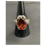Sterling silver ring with red-orange oval stone