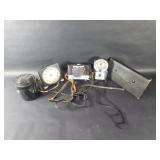 Group of vintage camera, desk clock, lamp, etc.
