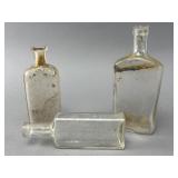 Three Clear Glass Bottles