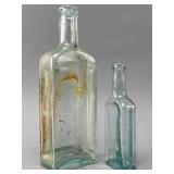Two Clear and Aqua Glass Bottles