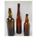 Three Brown Glass Bottles