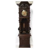 Intricately carved grandfather clock