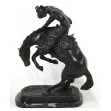 Horse statue on marble base after Remington
