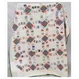 Hand stitched double wedding band quilt