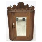 Hanging corner medicine cabinet