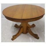 Round dining table on pedestal