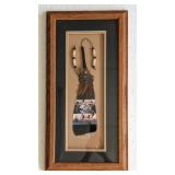 Shadow box of a Painted Feather