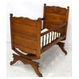 Carved Victorian walnut platform rocking baby crib