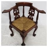 Rush seat carved mahogany corner chair