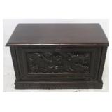 Heavily carved fall front cabinet