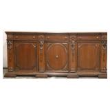 Heavily carved monumental early sideboard