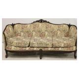 Ornately carved barrel arm sofa in tapestry