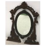 Carved walnut Victorian oval mirror in rack
