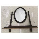 Oval mirror on rack