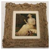 Canvas in heavily carved frame