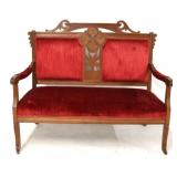 Victorian carved walnut settee with red velvet