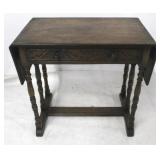 Carved drop side one drawer table